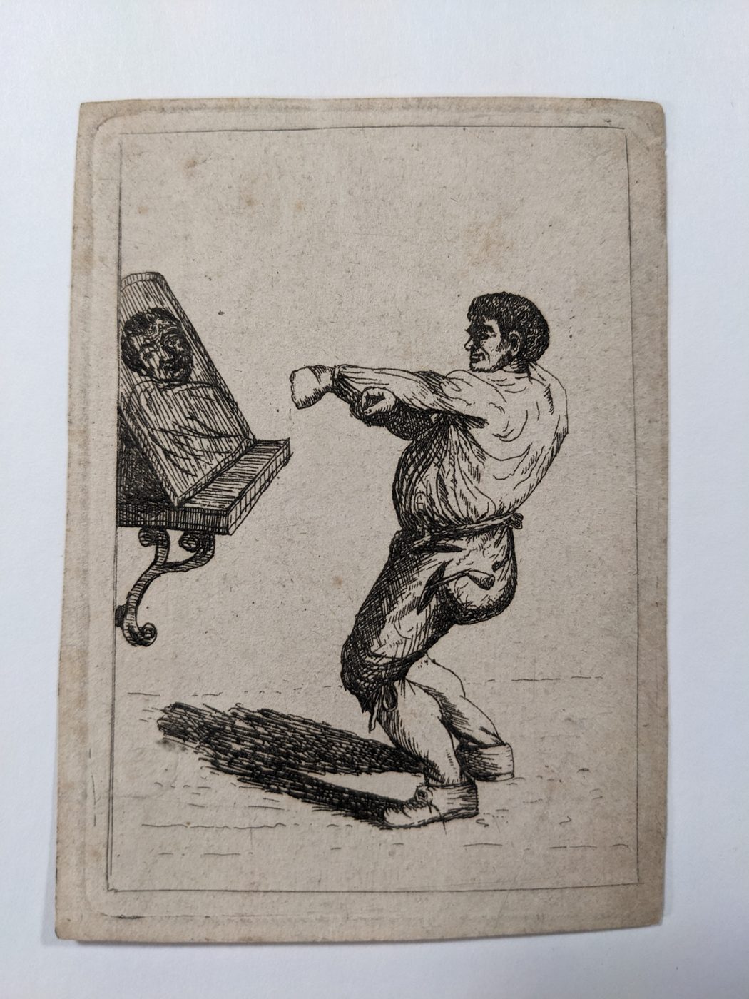 Man shadow boxing in a mirror