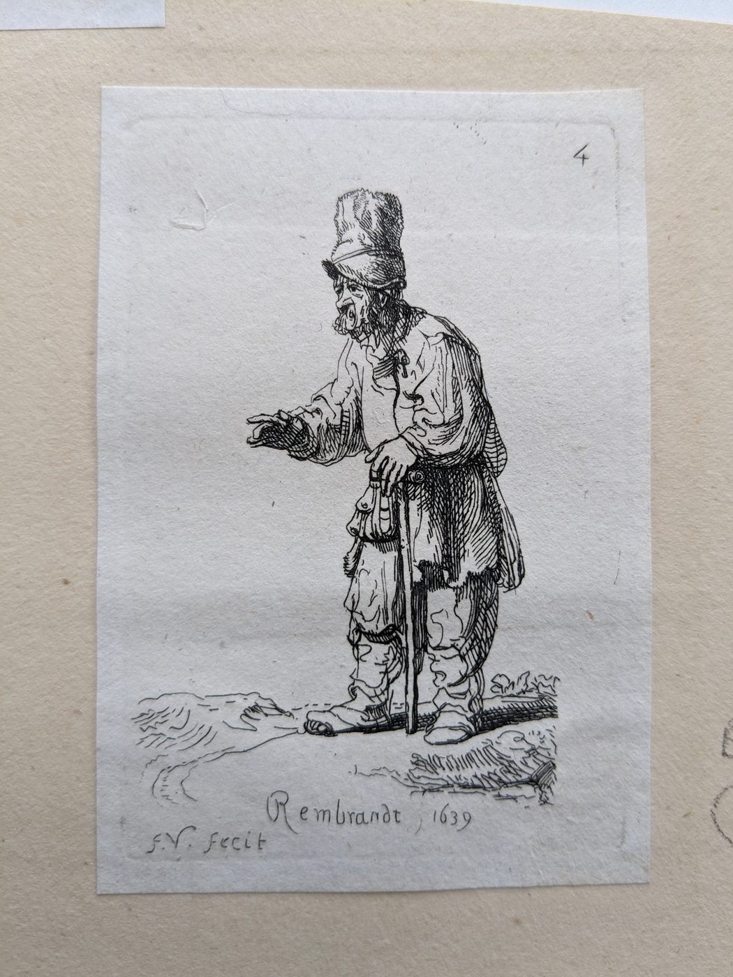 “Beggar leaning on a stick, facing left”