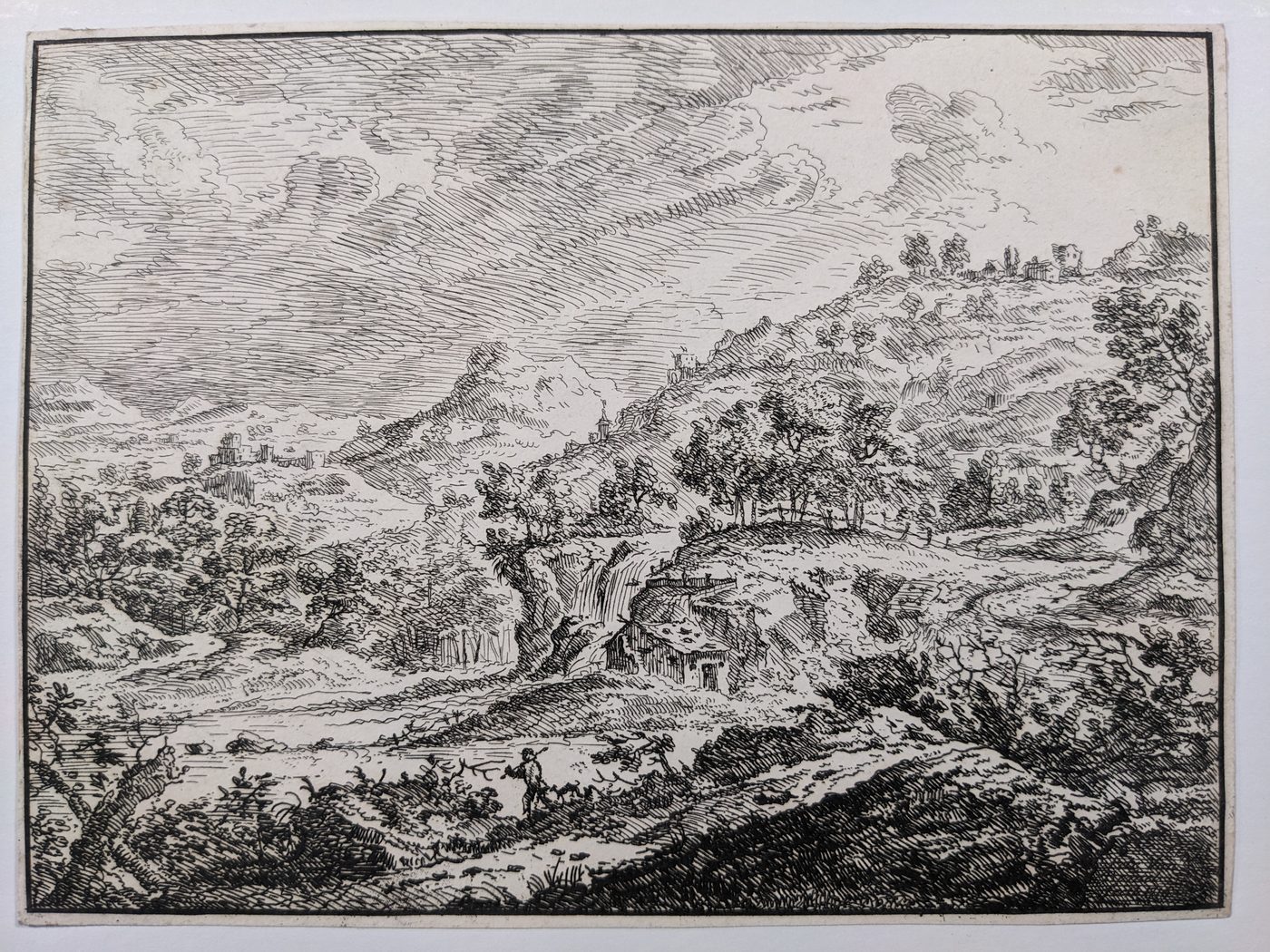 Landscape with a rural house next to a waterfall
