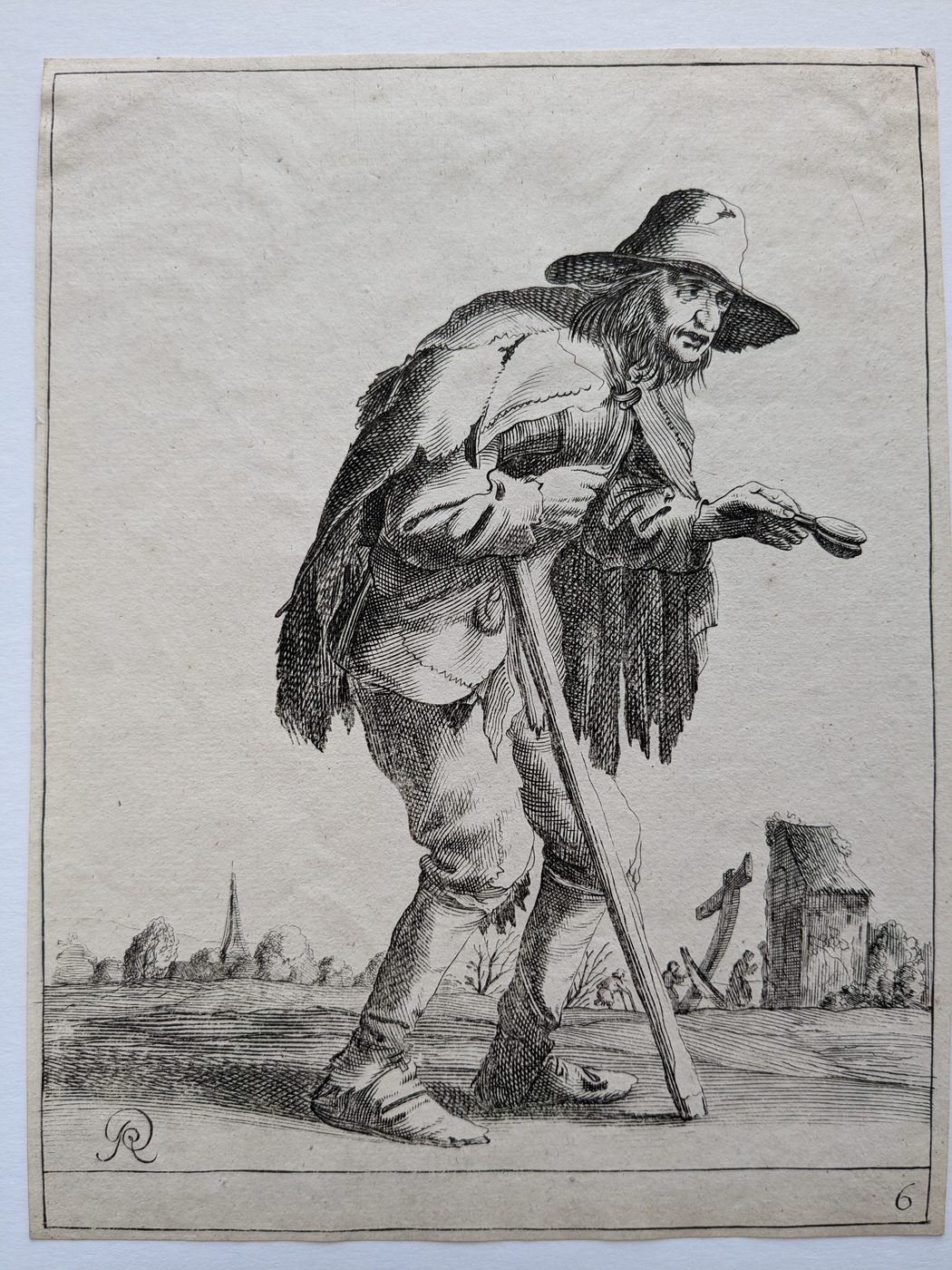 A male beggar with a crutch…